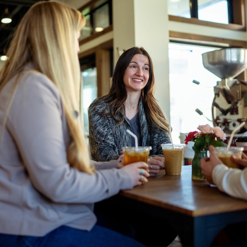 group of friends having coffee at the market on the plaza small business in aberdeen